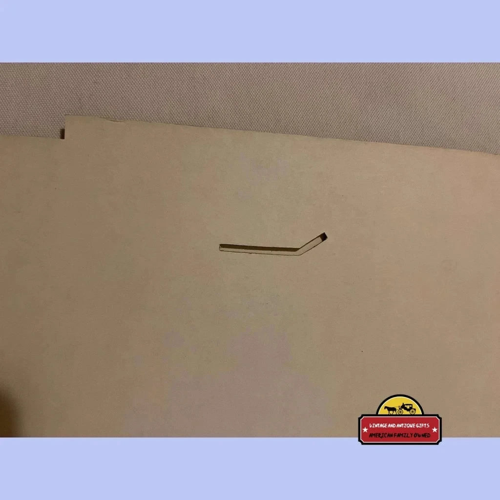 Hockey stick on wall showcasing Rare 3D Vantage Cigarette Sign from 1975 store display