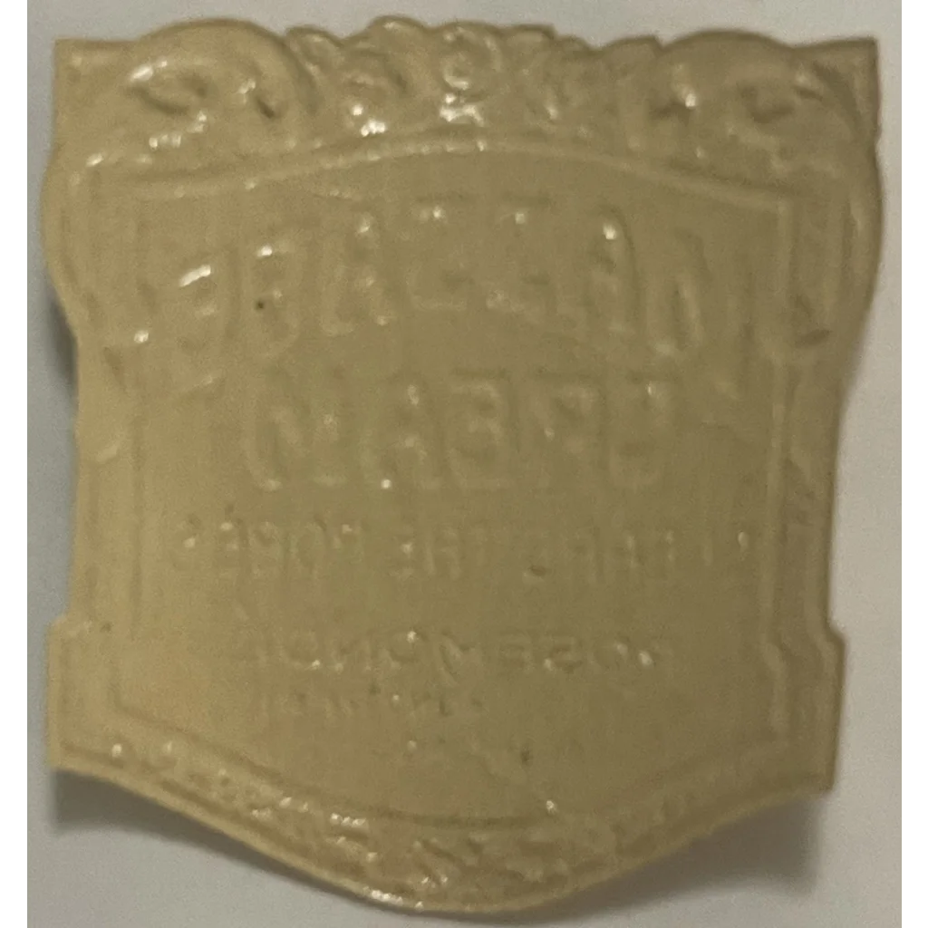 Cream-colored plaque with embossed lettering from Rare 1910s Massage Cream Label