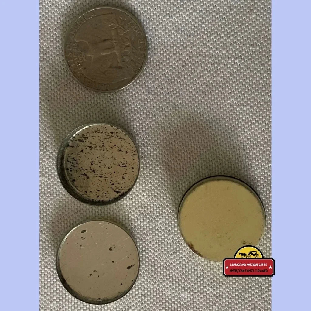 Four colorful antique vintage tokens from the Rare Antique Vintage 1910s InStep Sample Tin