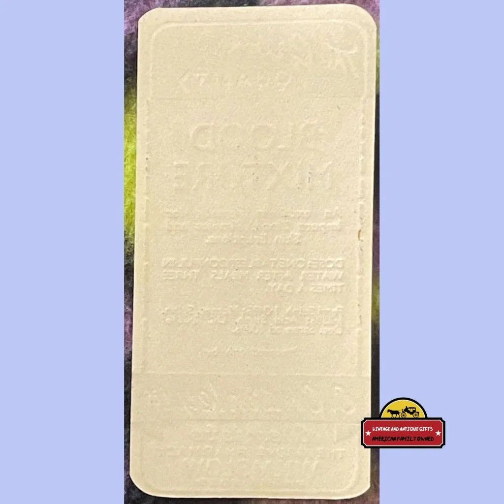 Rectangular beige mattress next to Rare Antique Blood Mixture Label from The Grove Pharmacy