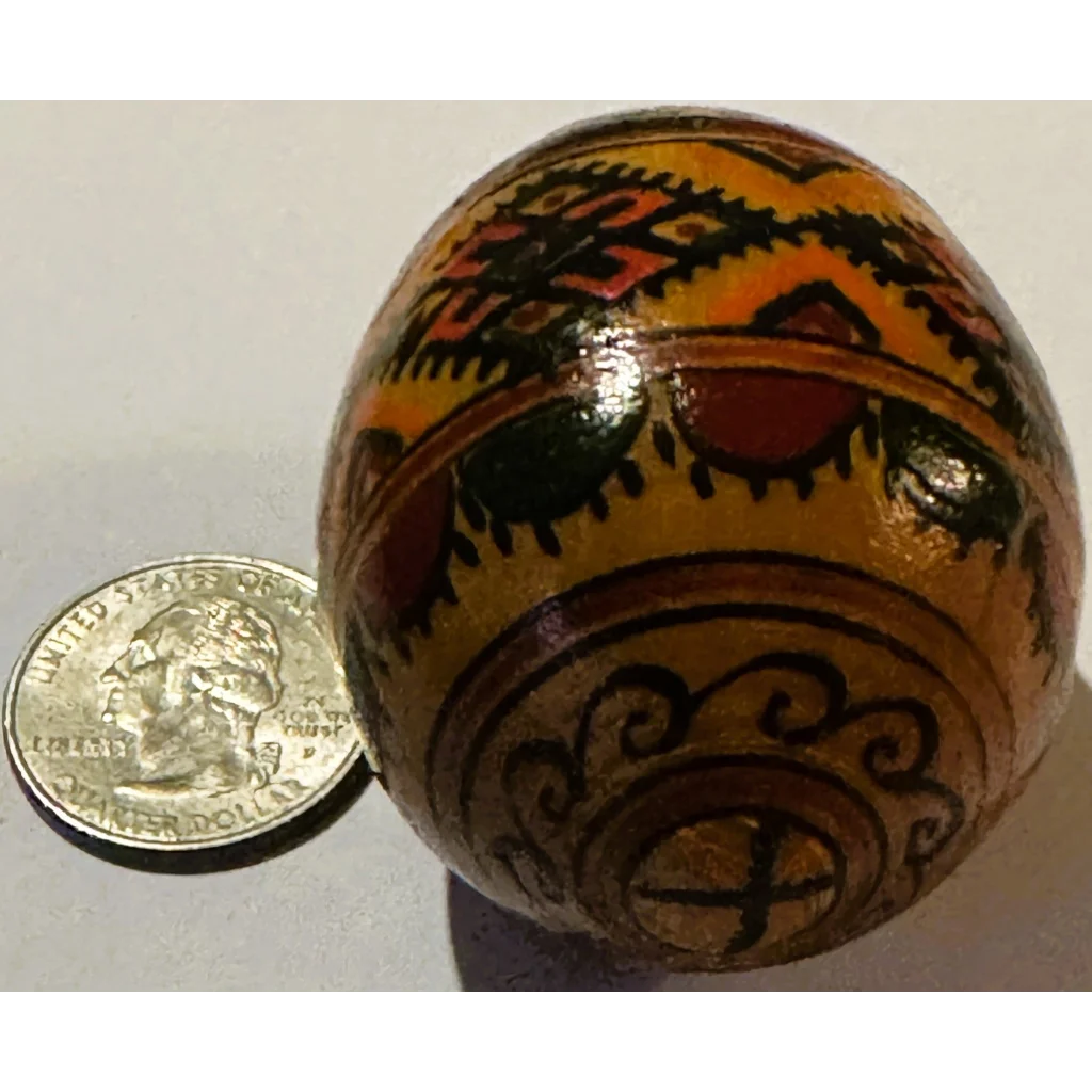 Decorated wooden pysanka egg with vibrant Ukrainian pysanka traditional design