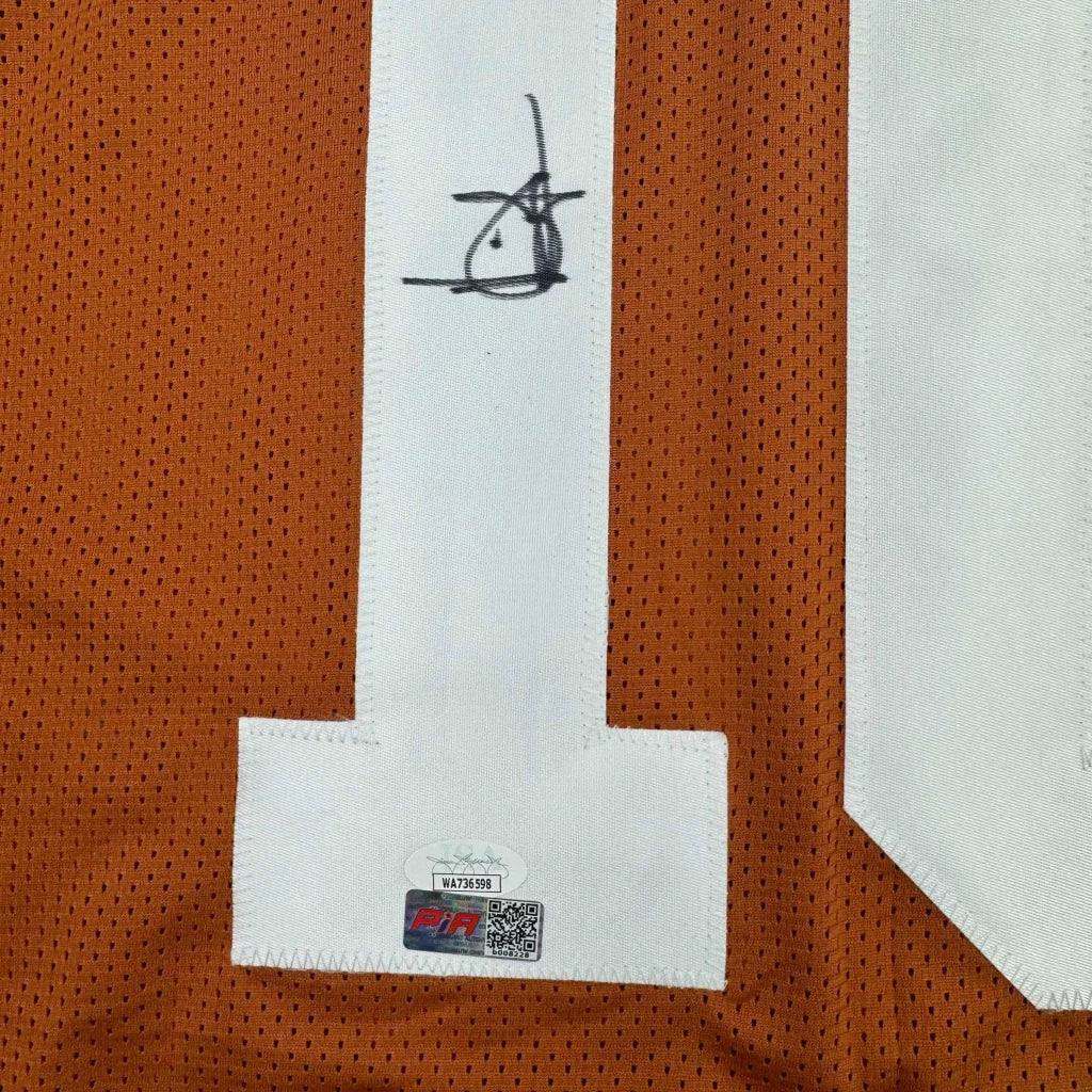 Signed orange Texas Longhorns jersey with white numbers for your man cave display