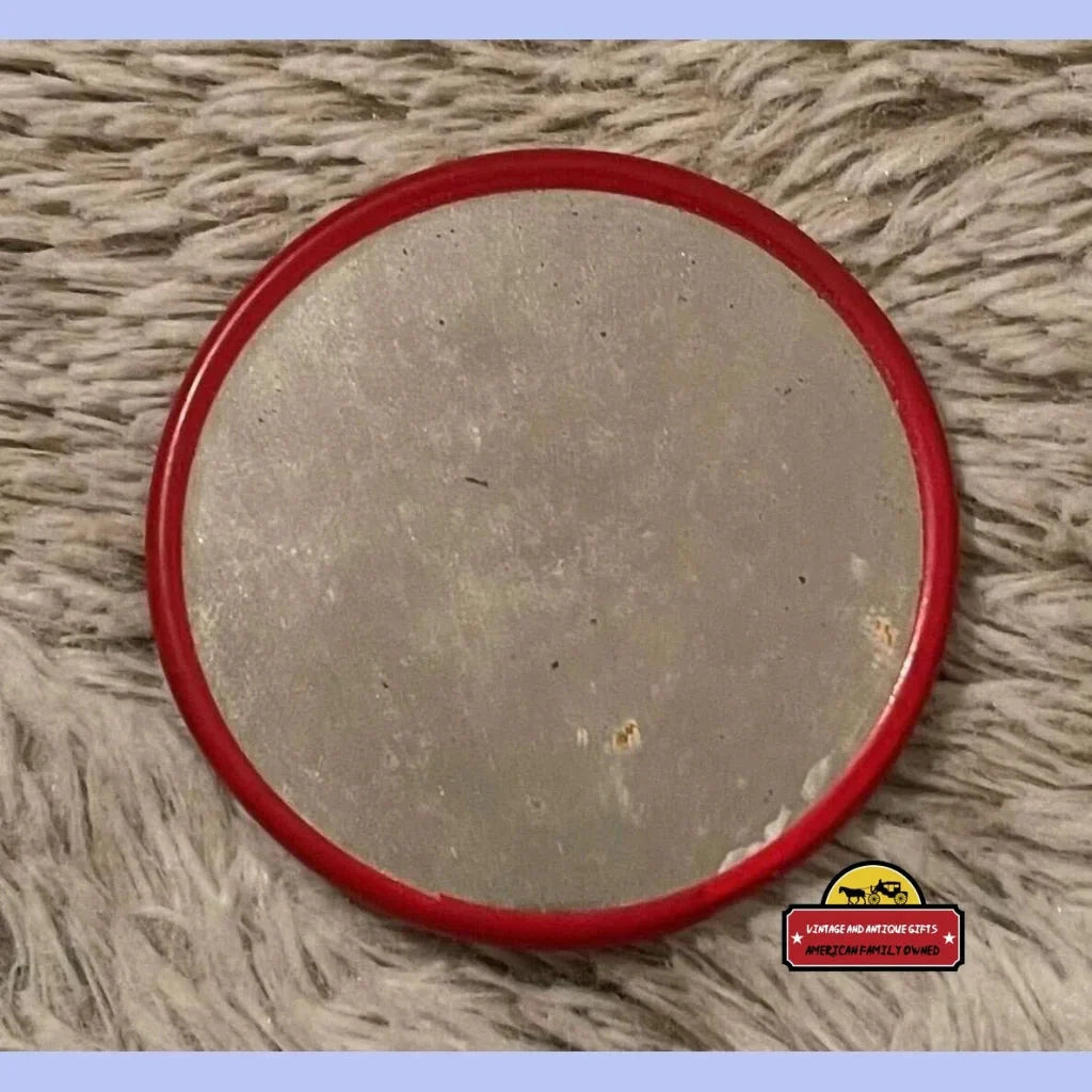 Circular mirror with a red plastic frame, perfect for your Shirley Jones pocket collection