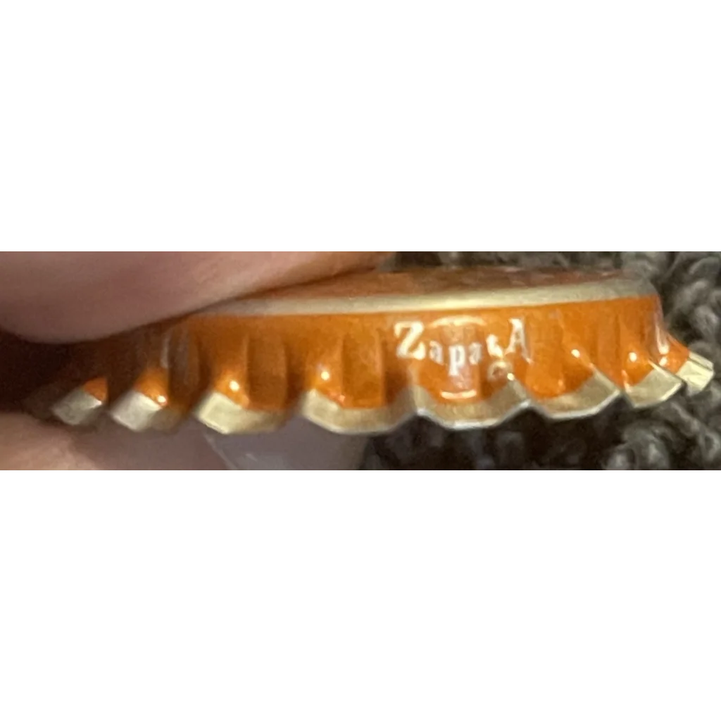 Rare 1970s orange soda bottle cap with Zapata on the edge from Salisbury, NC