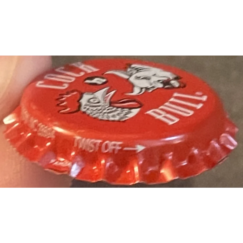 Red bottle cap with a cartoon owl design from 1970s Cock N Bull Soda, twist off style
