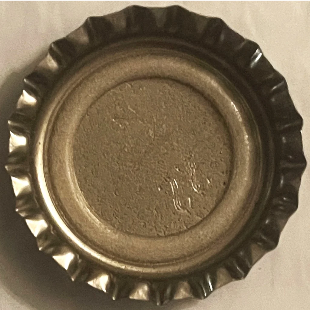 Vintage 1970s Sundrop soda bottle cap with a ridged edge and flat center, Americana collectible