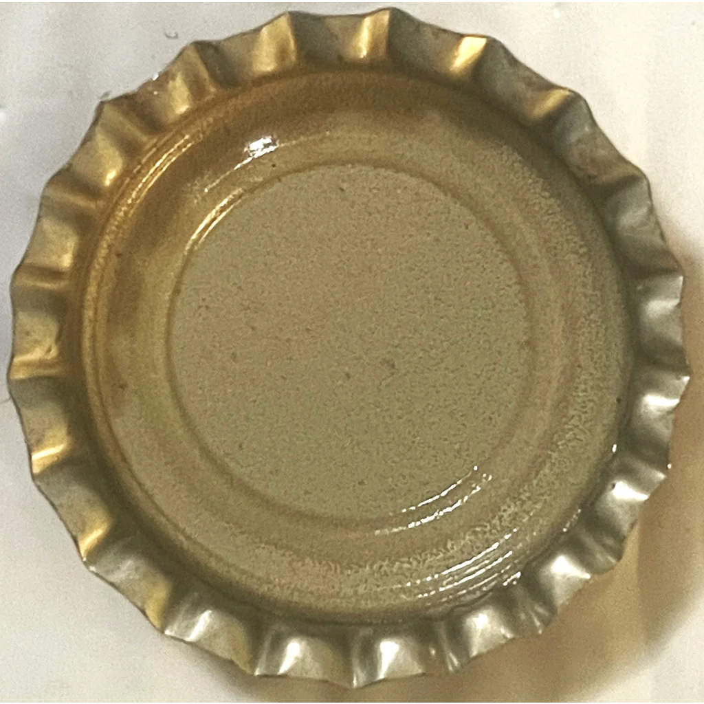 Gold bottle cap with crimped edge from Rare 1970s Whistle Strawberry Soda Bottle