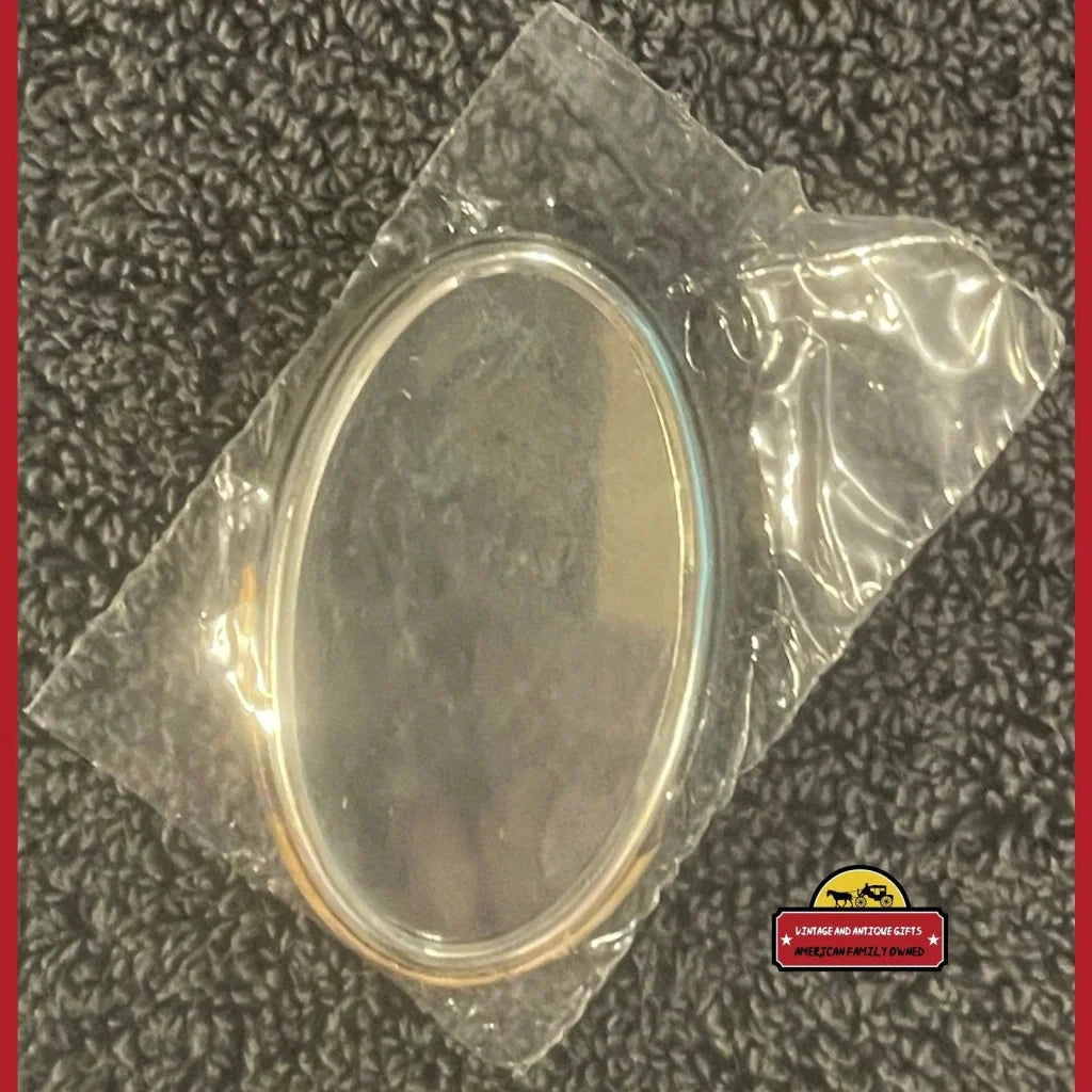 Oval lid of a Coca Cola mirror antique gift in sealed original package