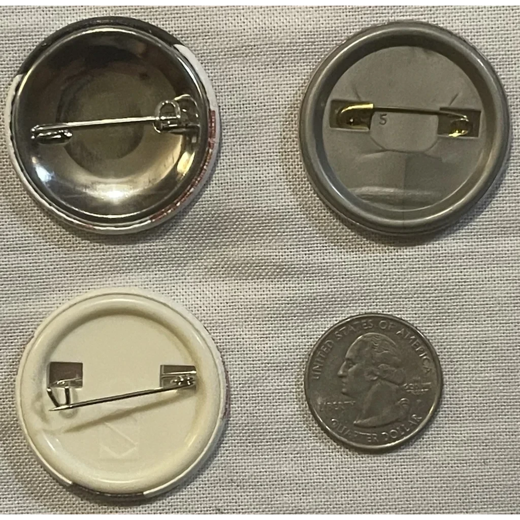 Button pin backs and a quarter next to the Rare 1990 Teenage Mutant Ninja Turtles Michelangelo Pin