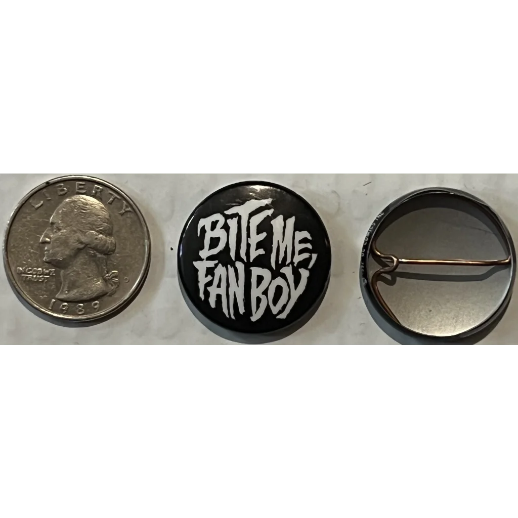 Black and white circular boy promo pin featuring BITE ME FAN BOY text in cool design