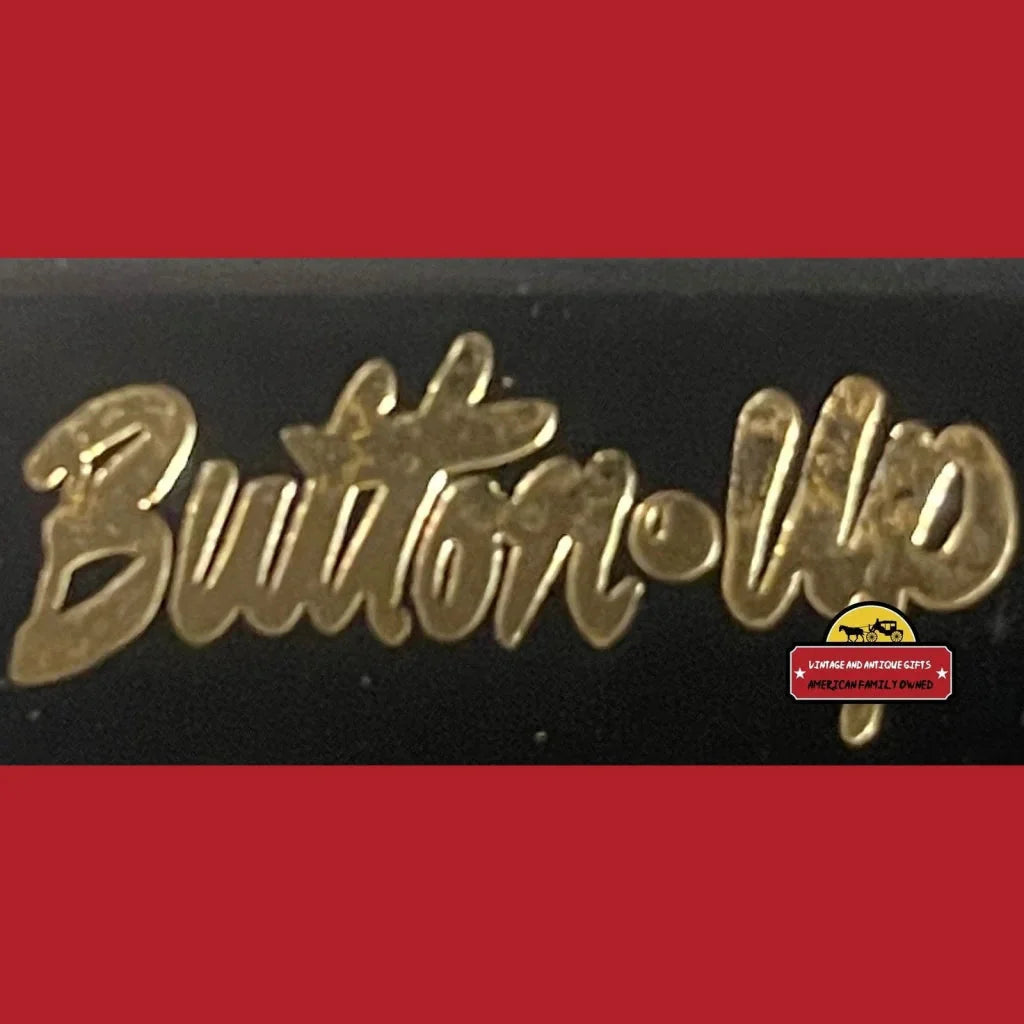 Gold cursive Button-Up text on dark background with Rare NKOTB Green Earrings