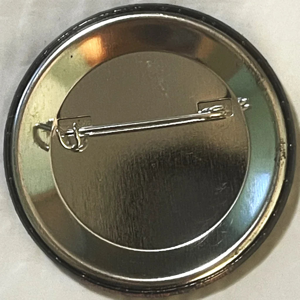 Metallic circular pin with safety pin backing for Bram Stoker’s Dracula fans