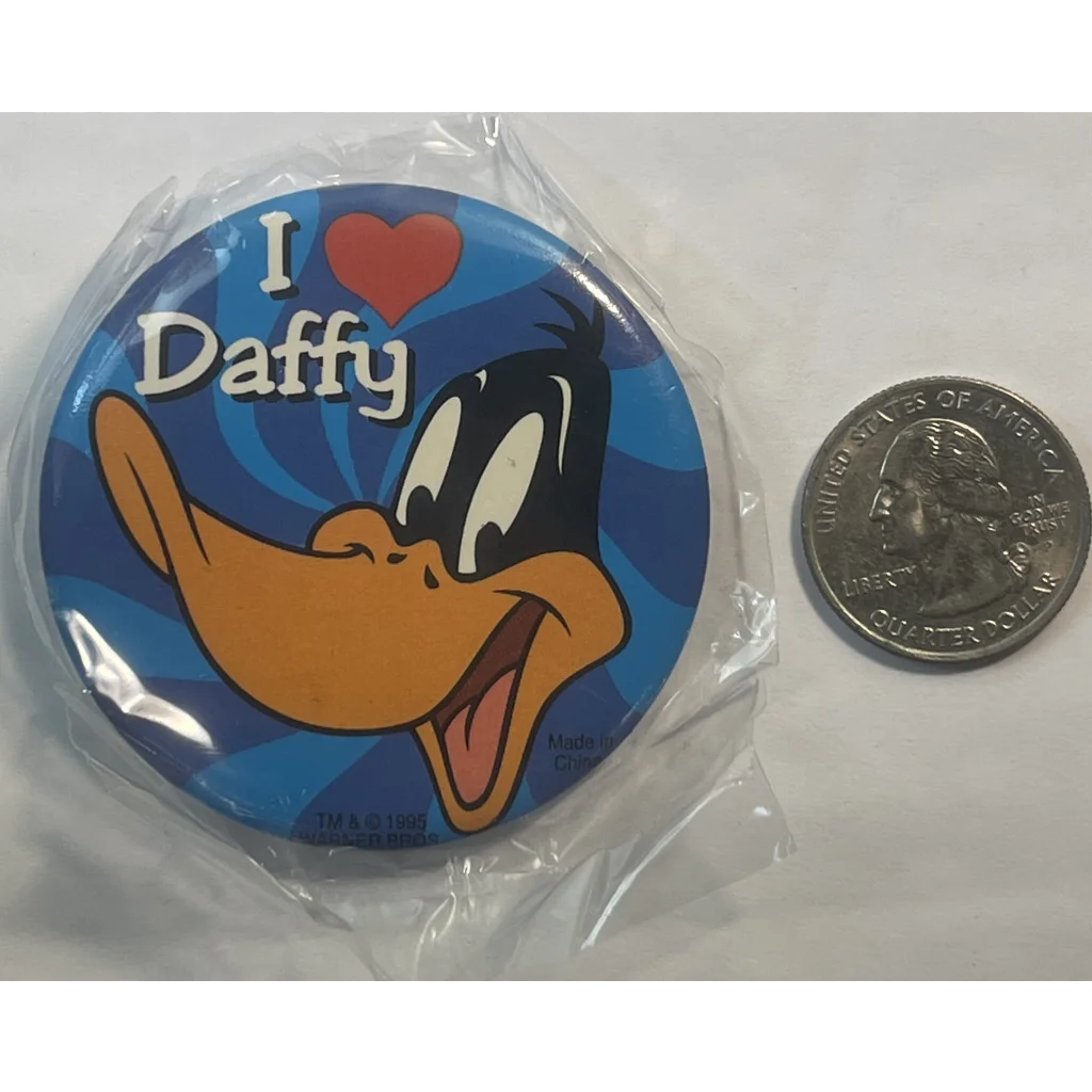 Circular Daffy Duck Looney Tunes pin with I ❤️ Daffy on blue background, rare find!