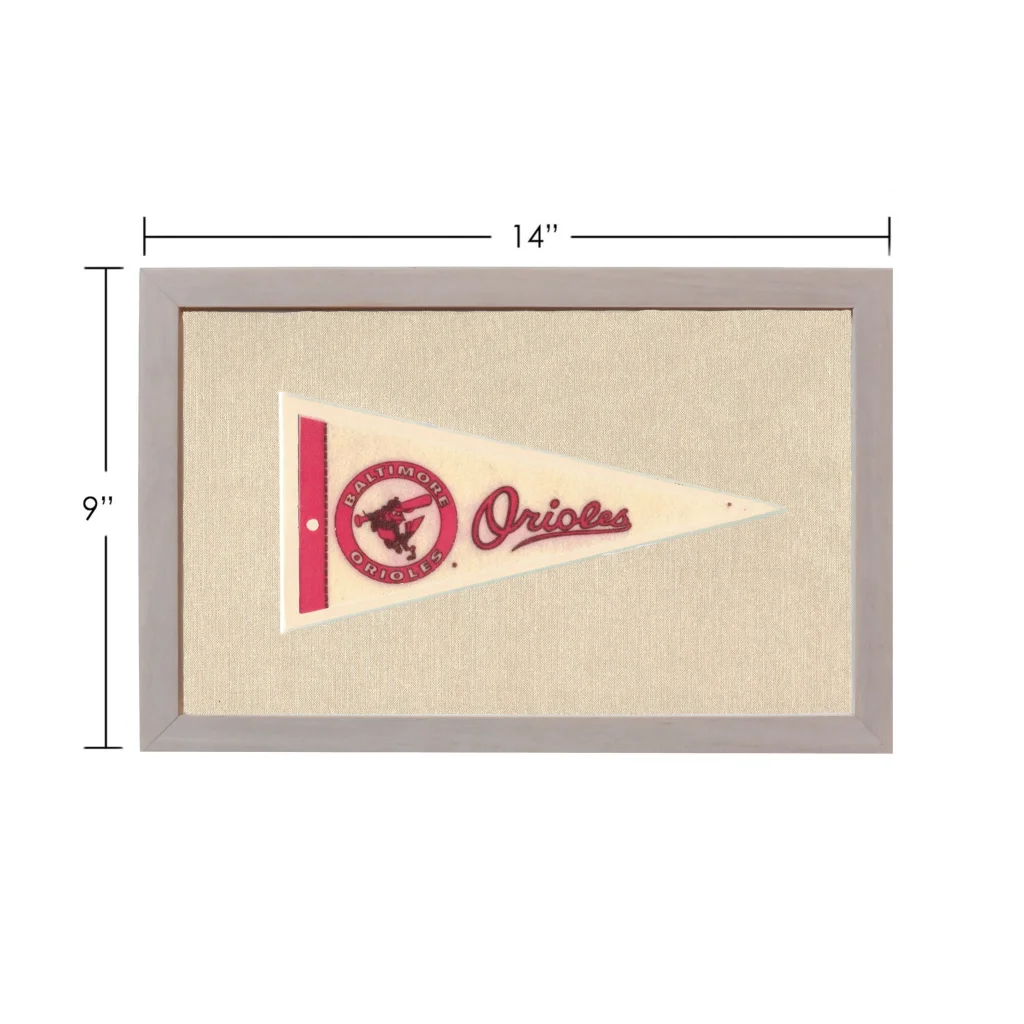 Vintage Baltimore Orioles pennant in cream with red logo and gray frame