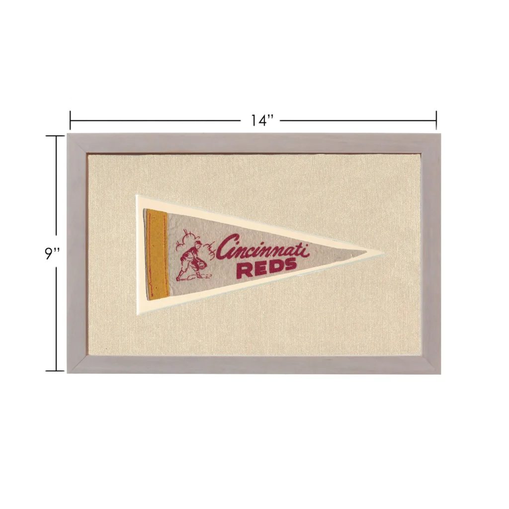 Vintage Cincinnati Reds pennant with beige background and baseball player illustration