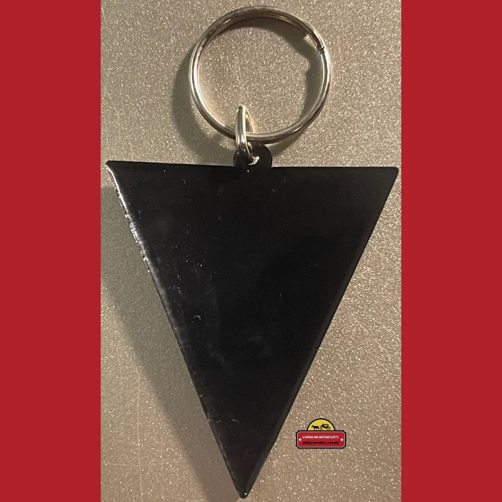 Black triangular keychain with metal ring, perfect for vintage NFL Coca-Cola fans