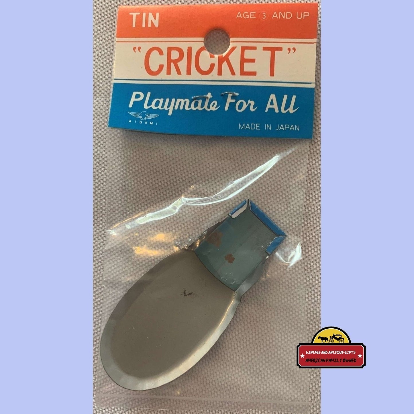 Cowgirl tin clicker cricket toy in vintage packaging labeled Playmate For All