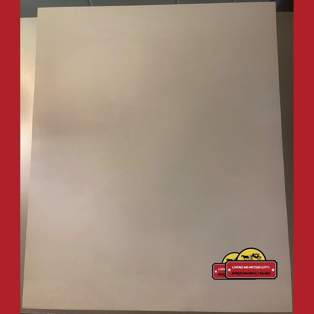 Blank white canvas with a cartoon car logo near Vintage Max Headroom Coca-Cola poster