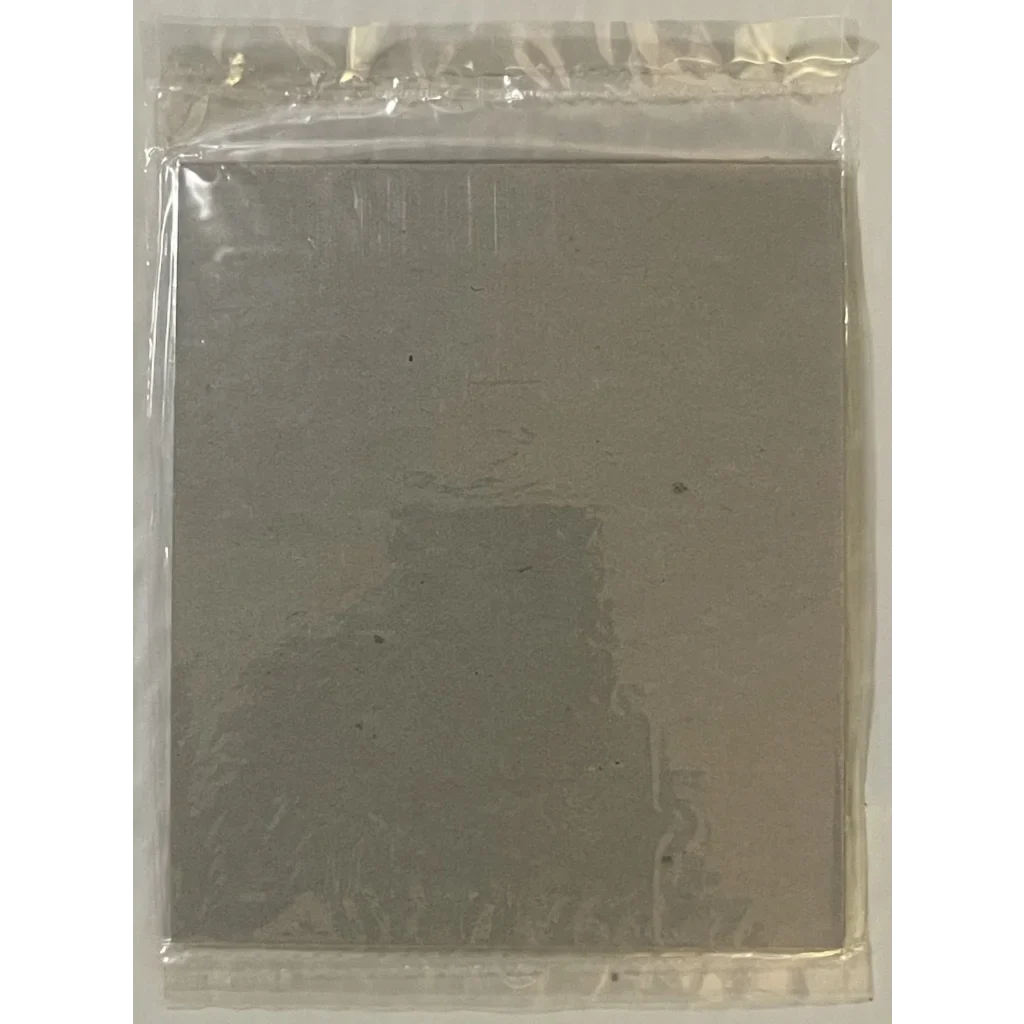 Gray metal plate in plastic bag for Limited Edition Heinz Ketchup Puzzle fun