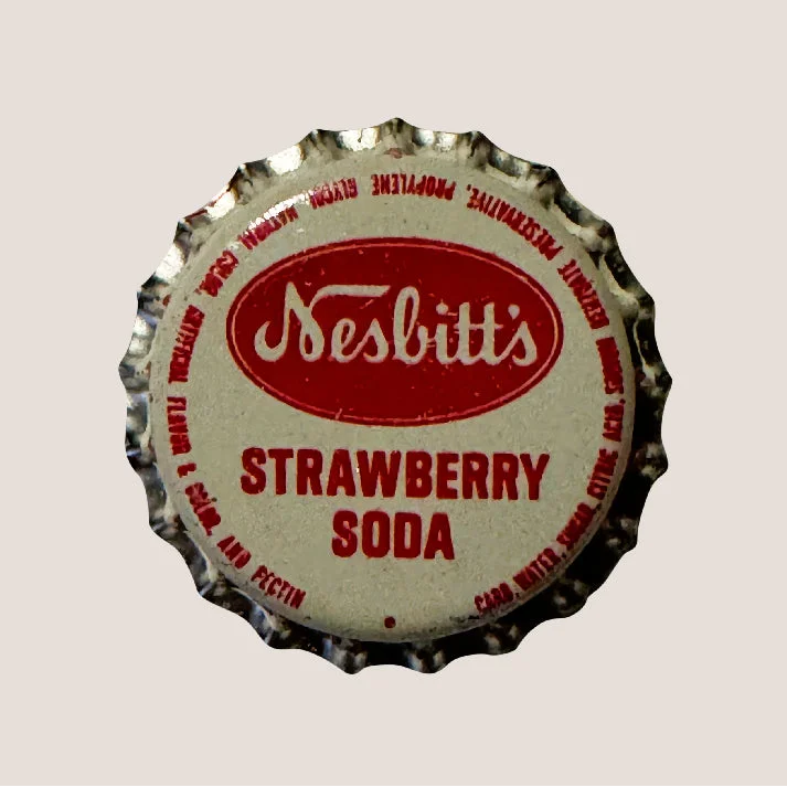 Vintage Nesbitts Strawberry Soda Bottle Cap showing classic soda bottle cap design