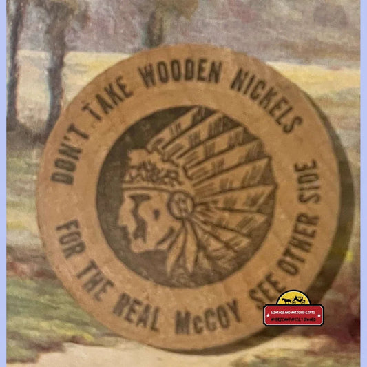 Circular tan wooden nickel engraved with Native American chief headdress and text.