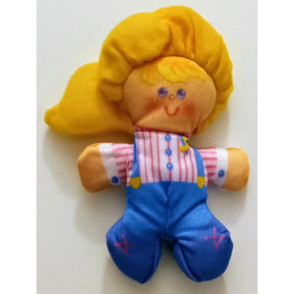 Vintage Smooshees Cuddler Cuties Heather plush doll in yellow with blonde hair and blue overalls