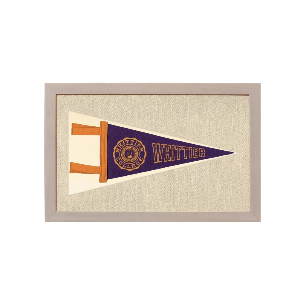 Vintage Whittier College pennant framed with navy blue field and gold logo