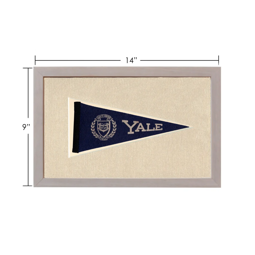Vintage Yale pennant in navy blue with white embroidered lettering, framed