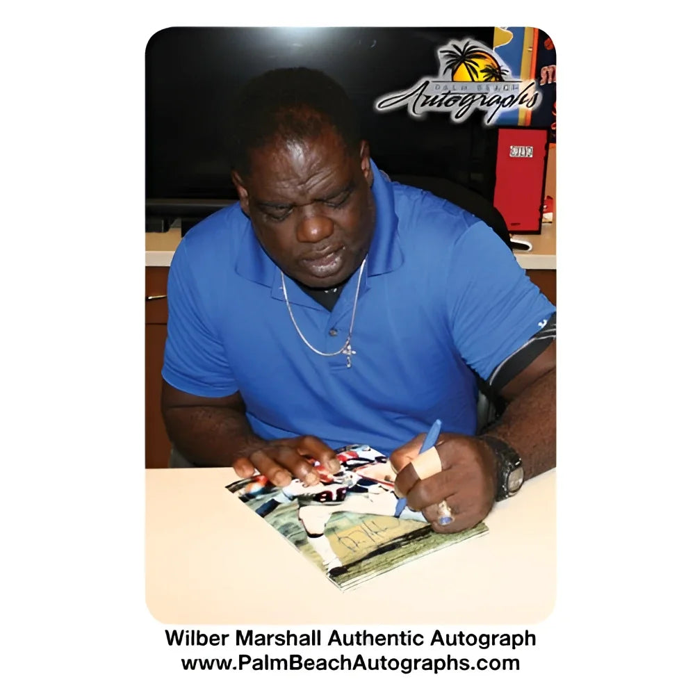 Wilber Marshall autographed Florida Gators 8x10 photo in blue polo shirt