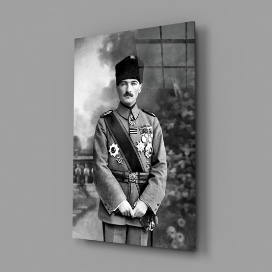 Black and white portrait photograph printed on glass wall art showing a man in military uniform with medals and a tall black hat, displayed at an angle against a gray wall.