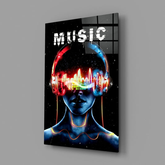 Angled view of glass wall art featuring neon glowing headphones on a stylized blue face with colorful sound wave display and "MUSIC" text.
