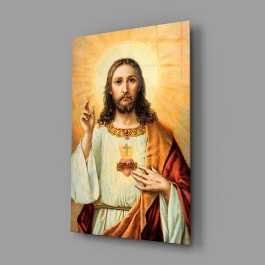 Angled front view of a glass wall art depicting Jesus with a halo, wearing robes in cream, gold, and red tones against a golden radiating background.
