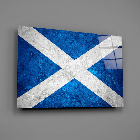 Deep blue glass wall art with white saltire cross and icy marble texture, displayed at angle against gray background.