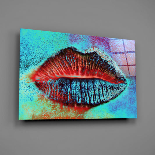 Vibrant glass wall art featuring a close-up of red lips with turquoise, cyan, and multicolored textured background, displayed at an angle against gray wall.
