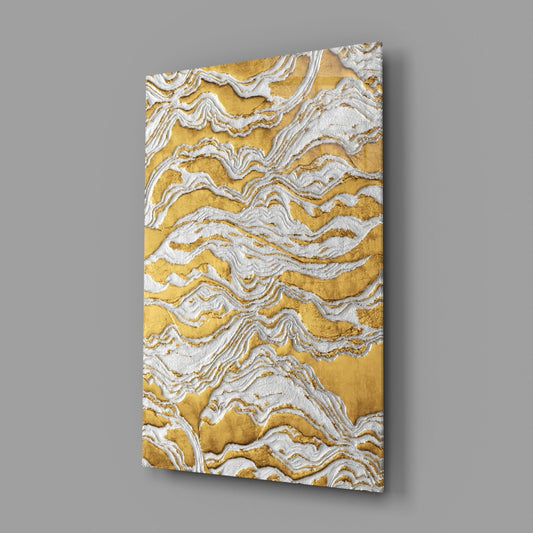 Angled perspective of golden and white textured glass wall art with wavy ridge patterns, displayed against neutral background.