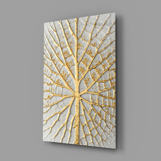 Angled perspective view of white textured glass panel with gold leaf vein pattern radiating from center.