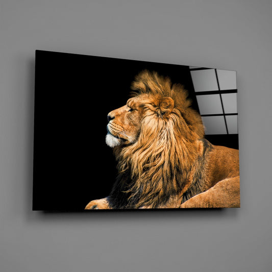 Golden lion in profile facing left against black background, displayed on glass wall art with grid pattern on right edge.