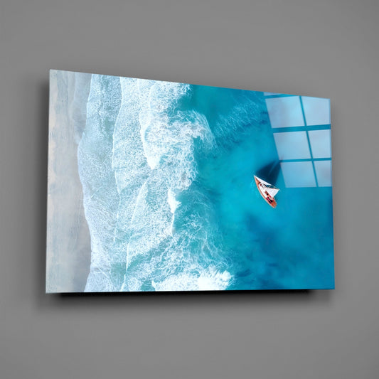 Aerial view of turquoise ocean waves and white sandy beach with small red and white boat, printed on glass panel.
