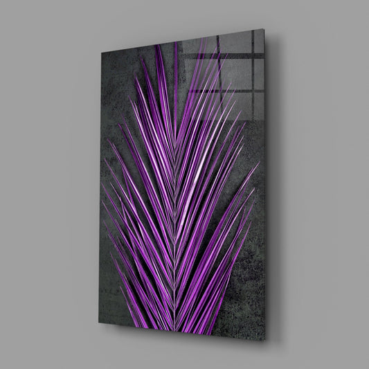Angled perspective of glass wall art displaying bright purple neon palm fronds radiating from center against textured gray background with grid pattern.