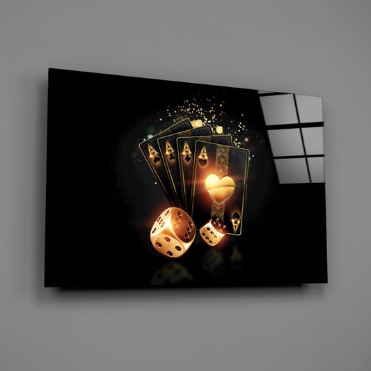 Glass wall art mounted on gray wall displaying glowing golden playing cards and dice with luminous heart symbol.
