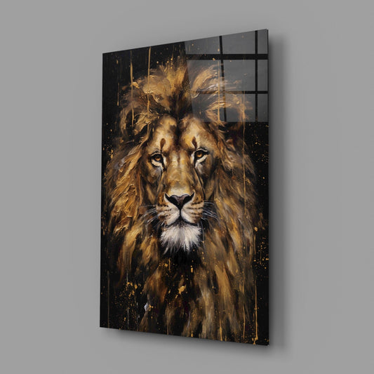 Angled view of glass wall art featuring a majestic lion's face with golden mane and black splatter details against dark background.