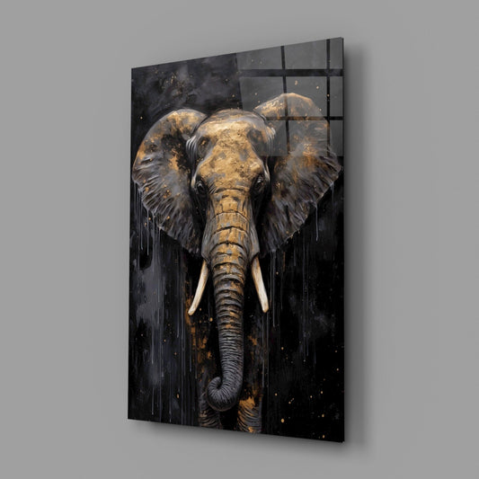 Black glass wall panel with gold leaf elephant head facing forward, displayed at an angle against gray wall.