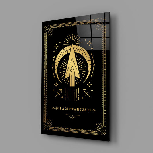 Angled perspective of black glass wall art featuring gold Sagittarius zodiac symbol with decorative border and text on dark background.