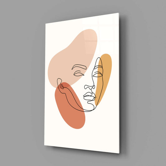 Abstract face with continuous line drawing and organic shapes in peach, coral, and gold tones on white glass panel, angled perspective view.