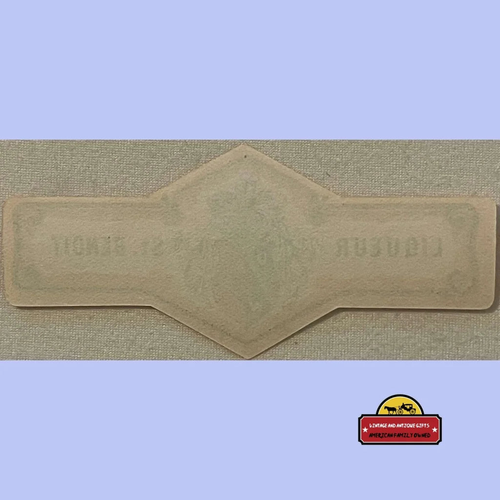 Beige diamond-shaped mold featuring embossed design for Rare Orange Antique Vintage Neck Label