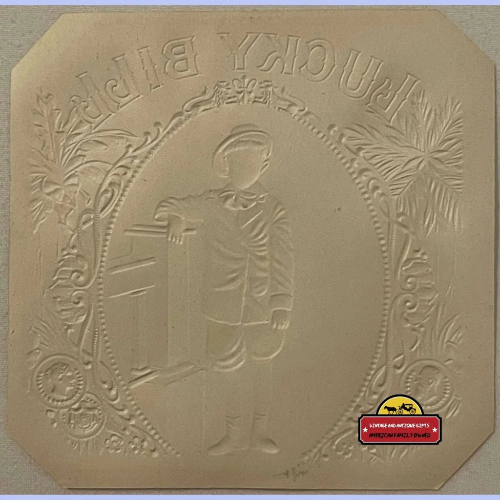 Embossed plaster mold of a Victorian boy surrounded by floral designs for an antique vintage cigar label
