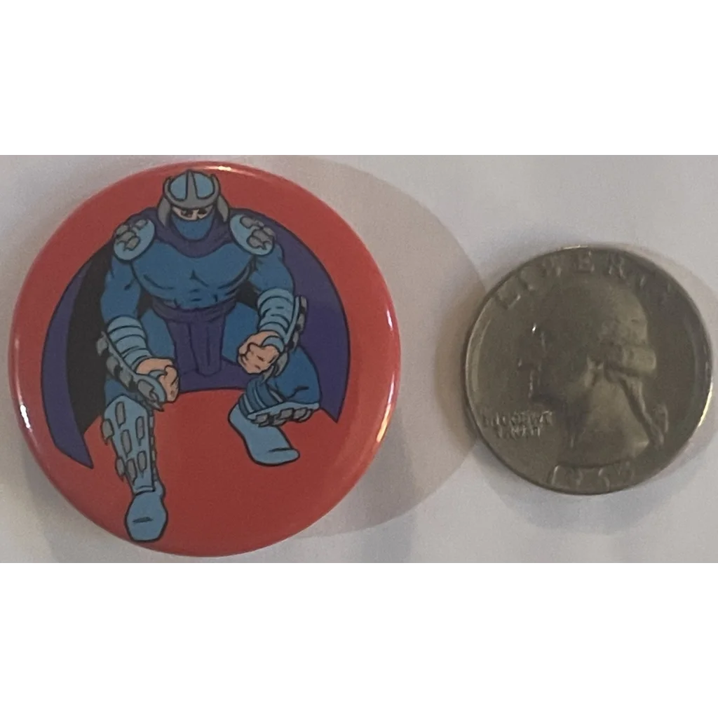 Circular Shredder movie pin from 1990 with armored character on red background