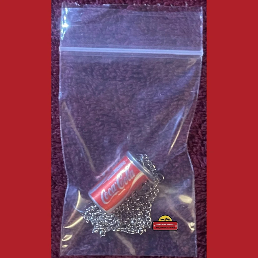 Plastic ziplock bag with a red lighter and metal chain for Vintage 1980s Coke necklace