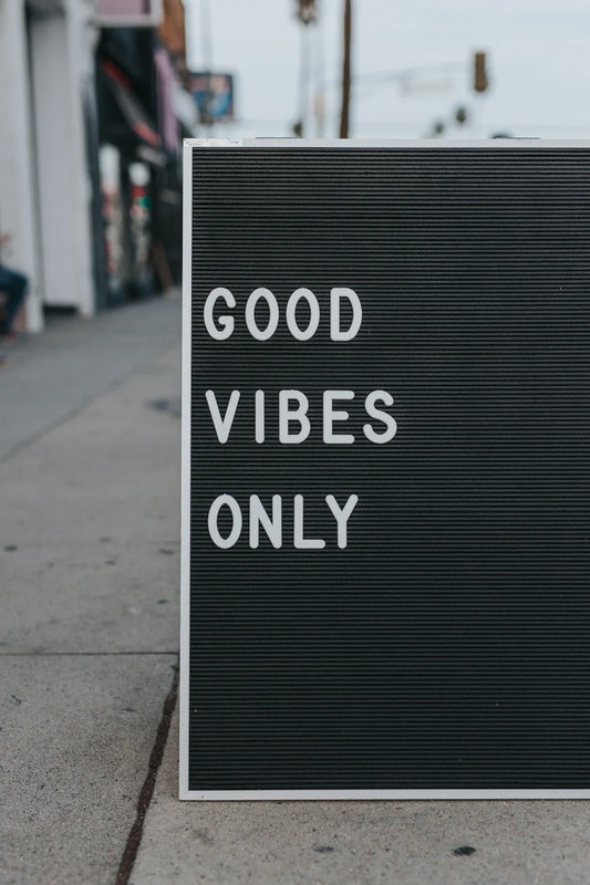 Black letter board with social movements and LGBTQ+ rights message for The 90s article