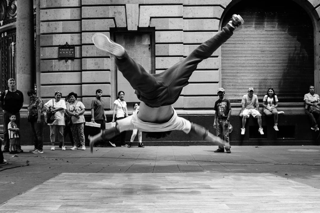 Male street dancer performing breakdance move symbolizing grassroots environmental activism